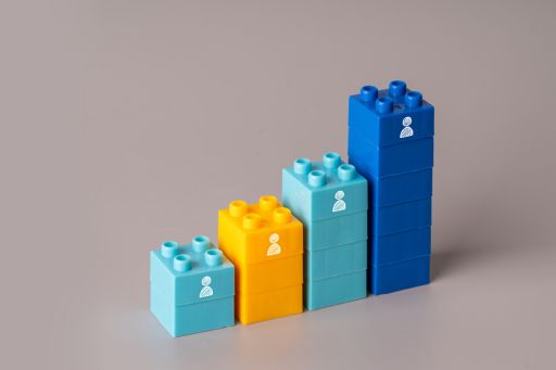 Stacked legos at different heights with people icons