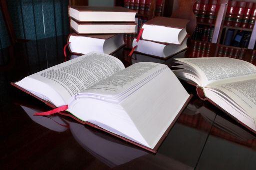 Law books open on a polished table