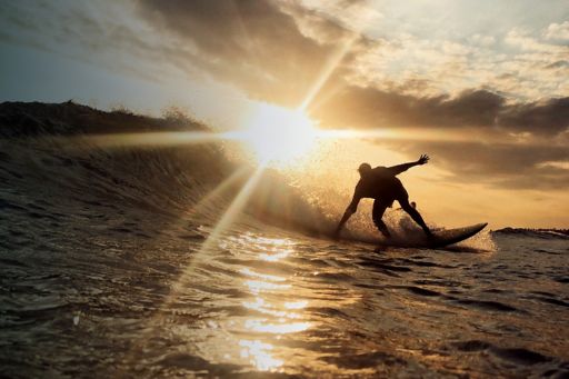 Man surfing at sunset