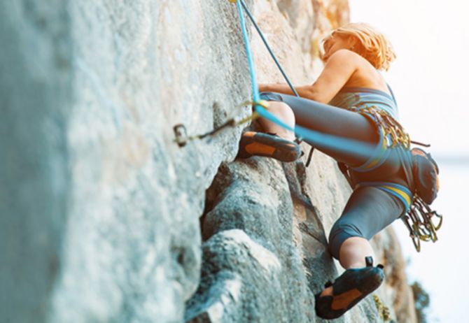 a-woman-rock-climbing