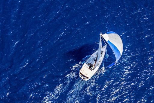 Aerial view of yacht sailing in the ocean