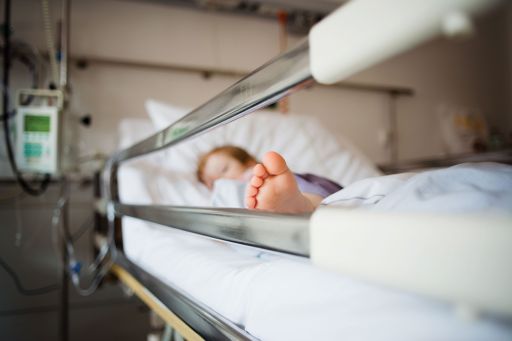 baby-lying-on-bed-in-hospital