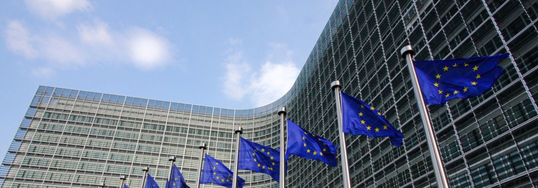 EU flags waiving in front on the European Commission