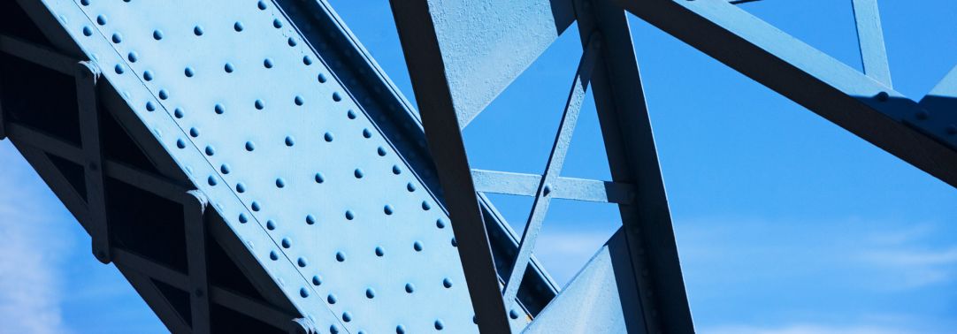 blue girders against a clear sky