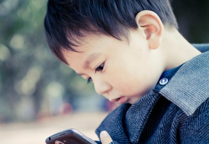 boy playing on a phone