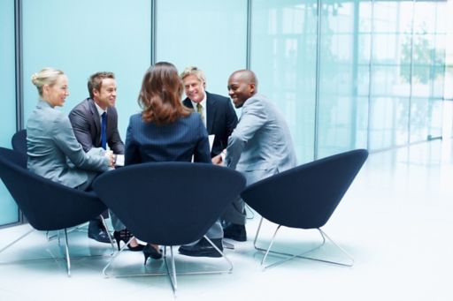 Business people talking on chairs