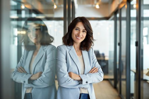 Business woman standing with arms folded 