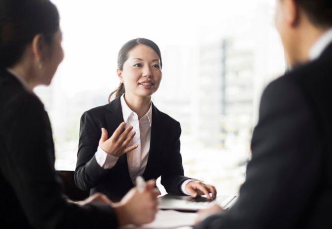 businesswoman in small group discussion