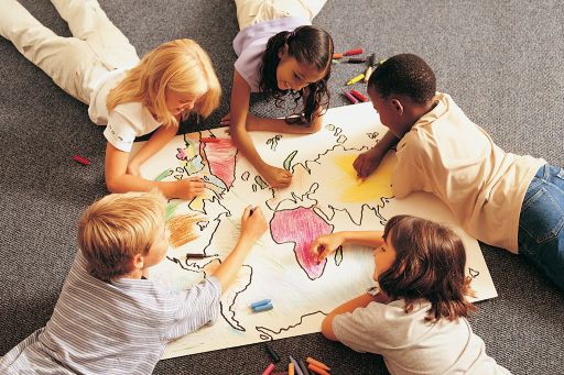 Children coloring a map