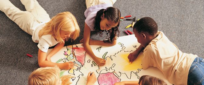 children coloring a map