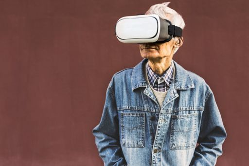 Hipster grandpa wearing virtual reality glasses