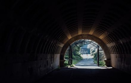 dark tunnel leading to park