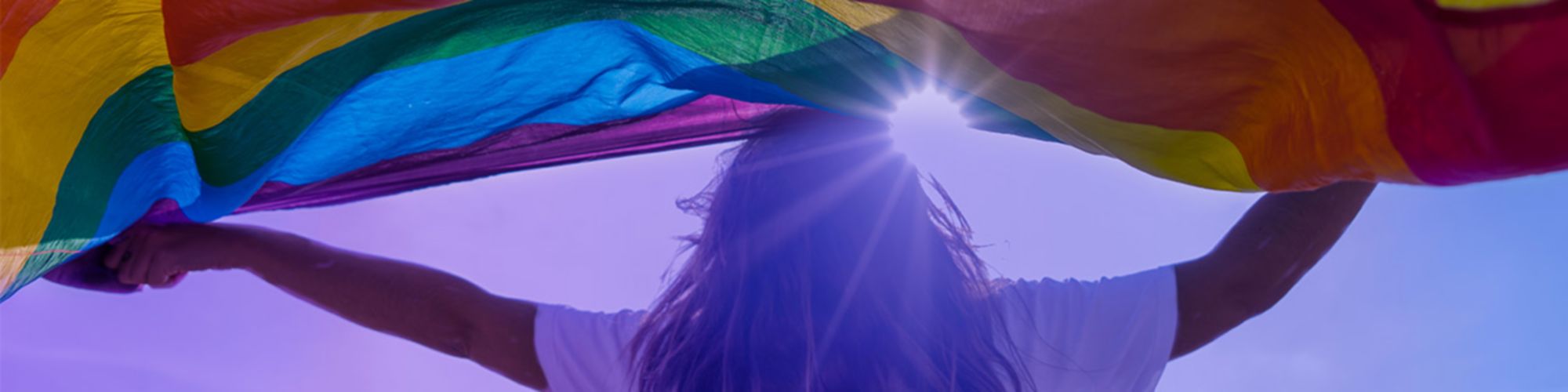 person with rainbow flag