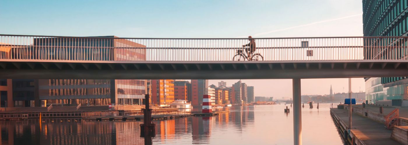 Cyclist riding across a bridge in Copenhagen
