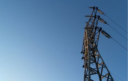 Electric pole against blue sky