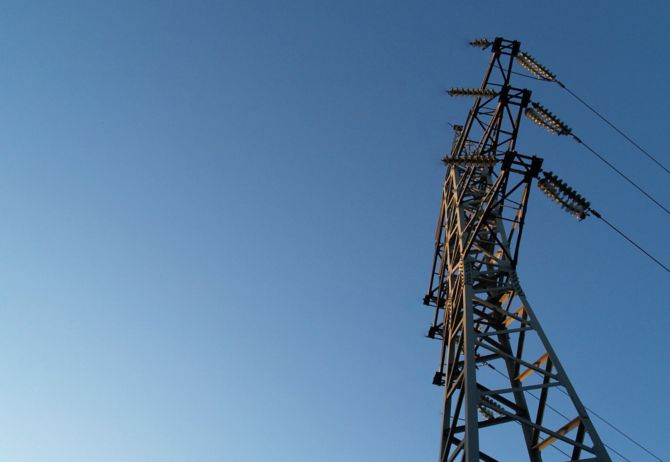 Electric pole against blue sky