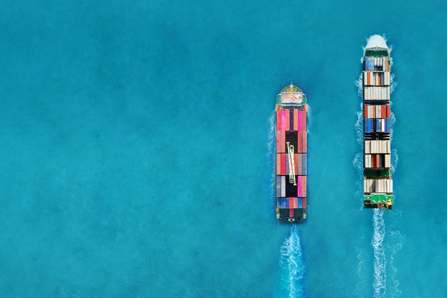 two cargo vessels sailing at sea