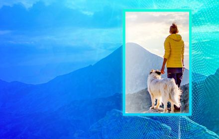 woman on mountain with dog