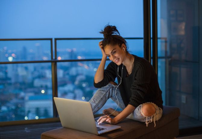 Girl sitting using her laptop