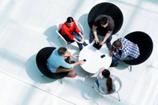employees sitting in a round table