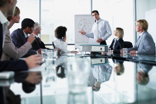 Man addressing a meeting in boardroom