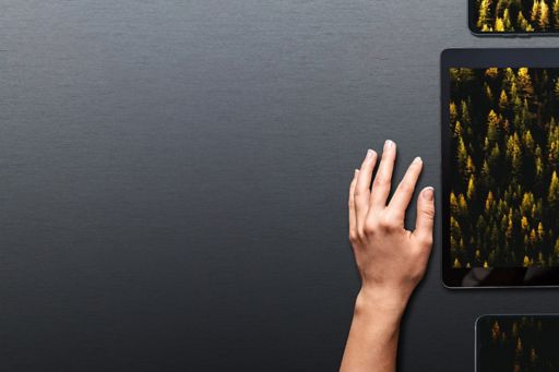 hand next to the tablet