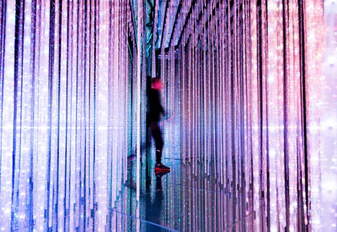 Man walking in the colorful lights