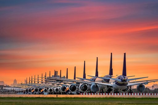A row of planes at sunset
