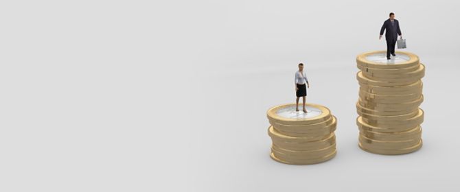 Male and female employee standing on stacks of coins - gender pay gap concept