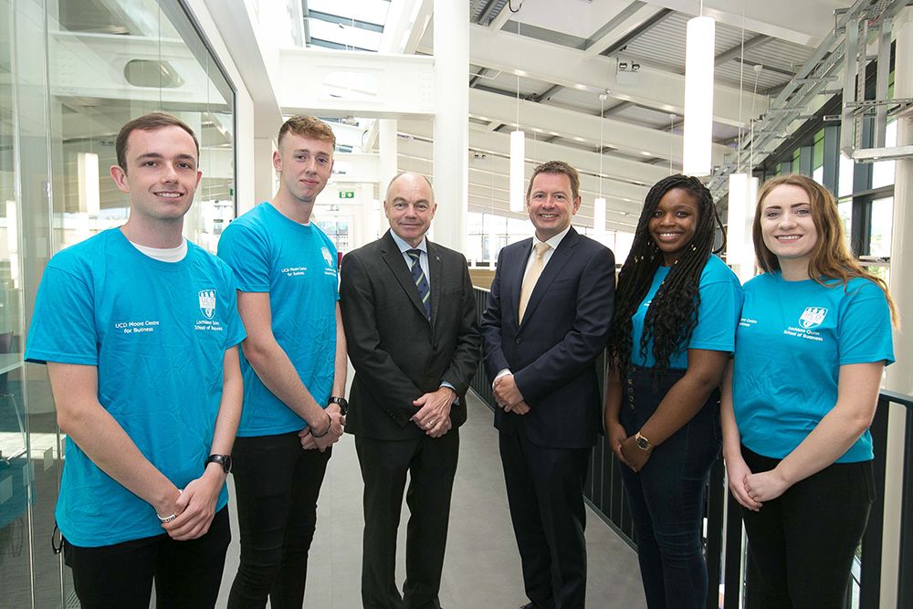 KPMG Managing Partner Seamus Hand and UCD President Professor Andrew Deeks pictured with students at the launch of the KPMG Skills Zone at the opening of the new Moore Wing at the UCD Quinn School of Business. 