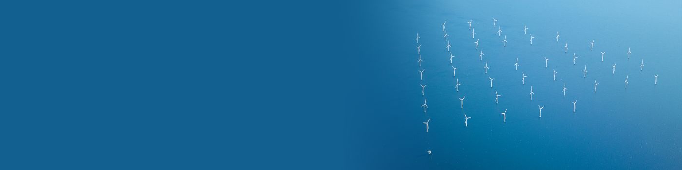 Offshore wind farm, aerial shot of wind turbines at sea