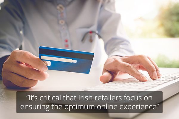 Hands holding credit card and typing with text overlaid "It’s critical that Irish retailers focus on ensuring the optimum online experience’"