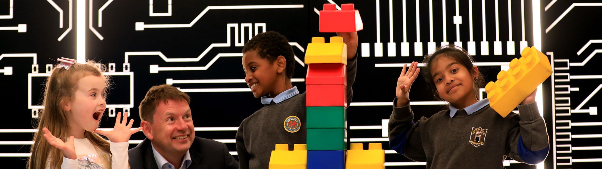 Seamus Hand, managing partner, KPMG in Ireland, with children from the KPMG Lego Club in Platform X
