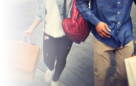 Couple holding shopping bags