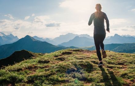 Woman jogging in hilly area