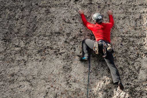 man climbing wall