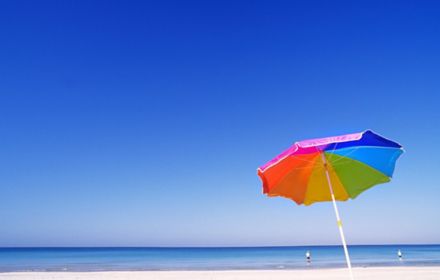 Multicolored parasol at beach 