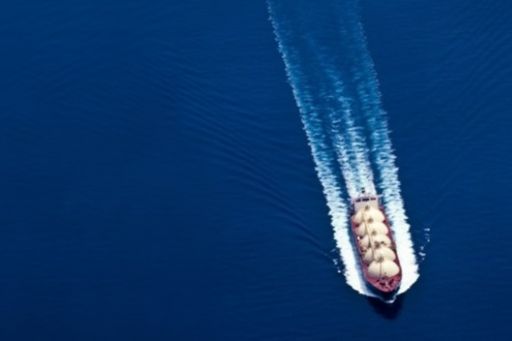oil tanker vessel aerial trolling lng over blue waves
