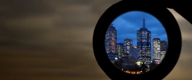 Looking at a city through magnifying glass