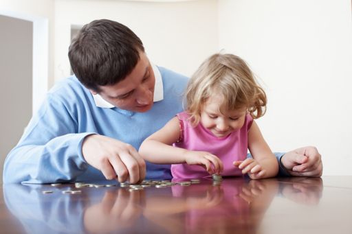 man and child counting coins