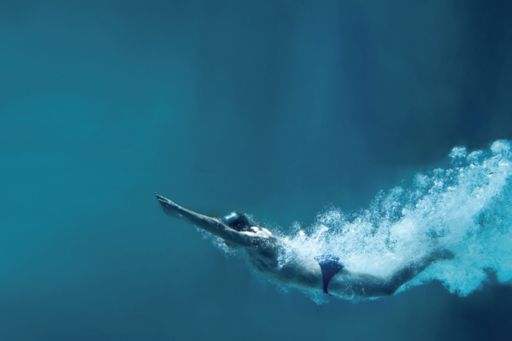 man diving in ocean