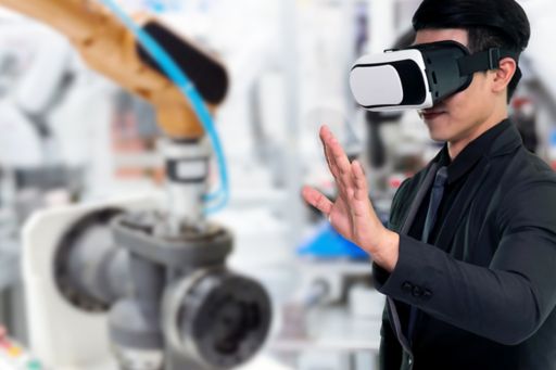 Man in black formals wearing VR raising hand against laboratory blur background