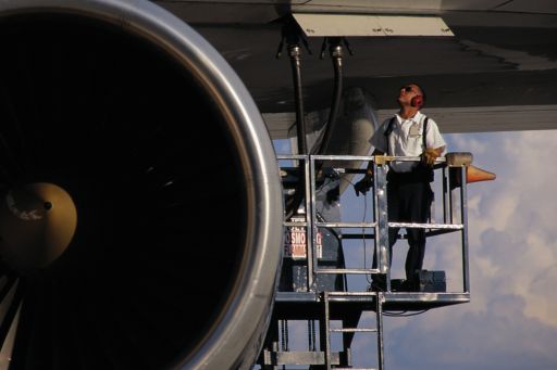 KPMG IFRS In the Headlines 2013/19 (general hedge accounting) publication image: worker working under the wing of an airplane
