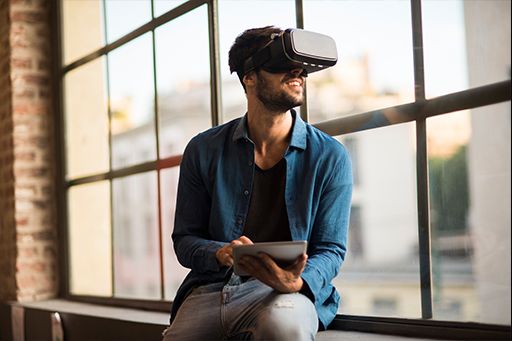 Man using virtual reality simulator headset