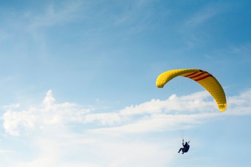 Man using yellow Parachute