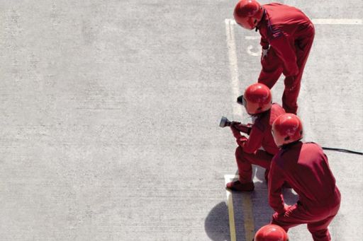 Men working in red uniform