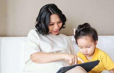 Mother and baby using tablet