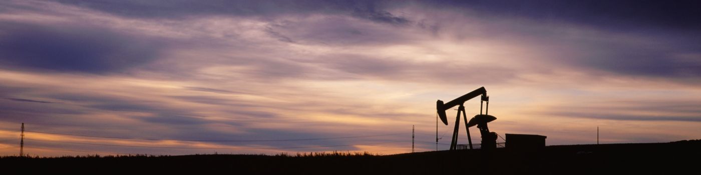 Oil drill at sunset