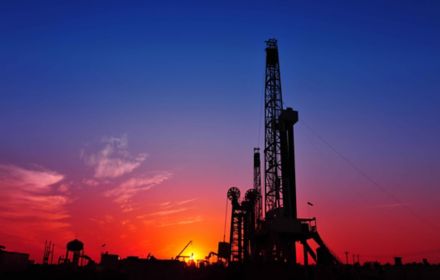 Oilfield rig sunset purple red blue horizon oil gas