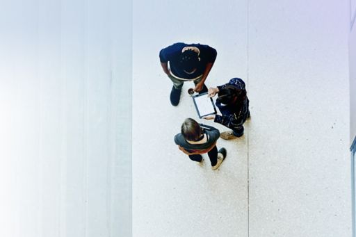Overhead view of workers collaborating